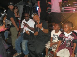 Freezy, Chairman of the FYFL sits with a couple of Miami gardens Vikings players , and rapper Plies